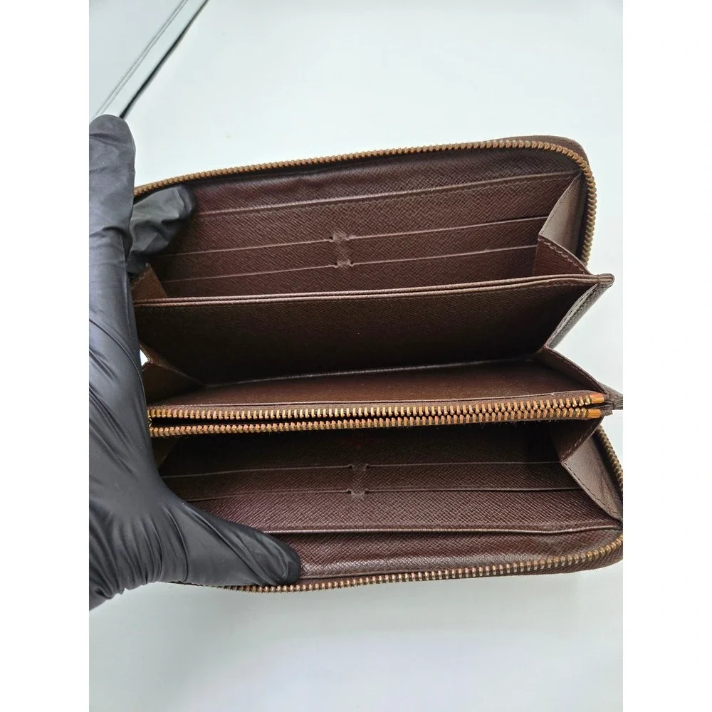 Louis Vuitton Damier Ebene Zippy Wallet Brown Coated Canvas